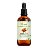 Rozenbottel olie 100 ml van Aza Natural, fles van donker glas met pipet en een etiket met rode rozenbottels