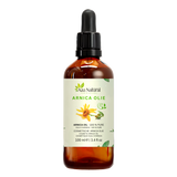 Huile d’arnica 100 ml Aza Natural, flacon en verre foncé avec pipette et une étiquette avec une fleur d’arnica jaune
