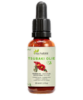 Fles tsubaki olie van Aza Natural, 30 ml, donker glas met pipet en een etiket met twee rode cameliabloemen