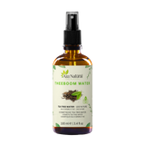 Flesje tea tree water van Aza Natural, 100 ml, bruin glas met sprayknop en een etiket met getekende blaadjes
