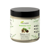 Huile de babassu 100 ml Aza Natural, pot en verre à couvercle noir, étiquette avec des noix de babassu entières et ouvertes