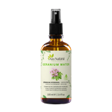 Flacon d’eau de géranium Aza Natural, 100 ml, verre brun avec spray et une étiquette avec des fleurs de géranium roses